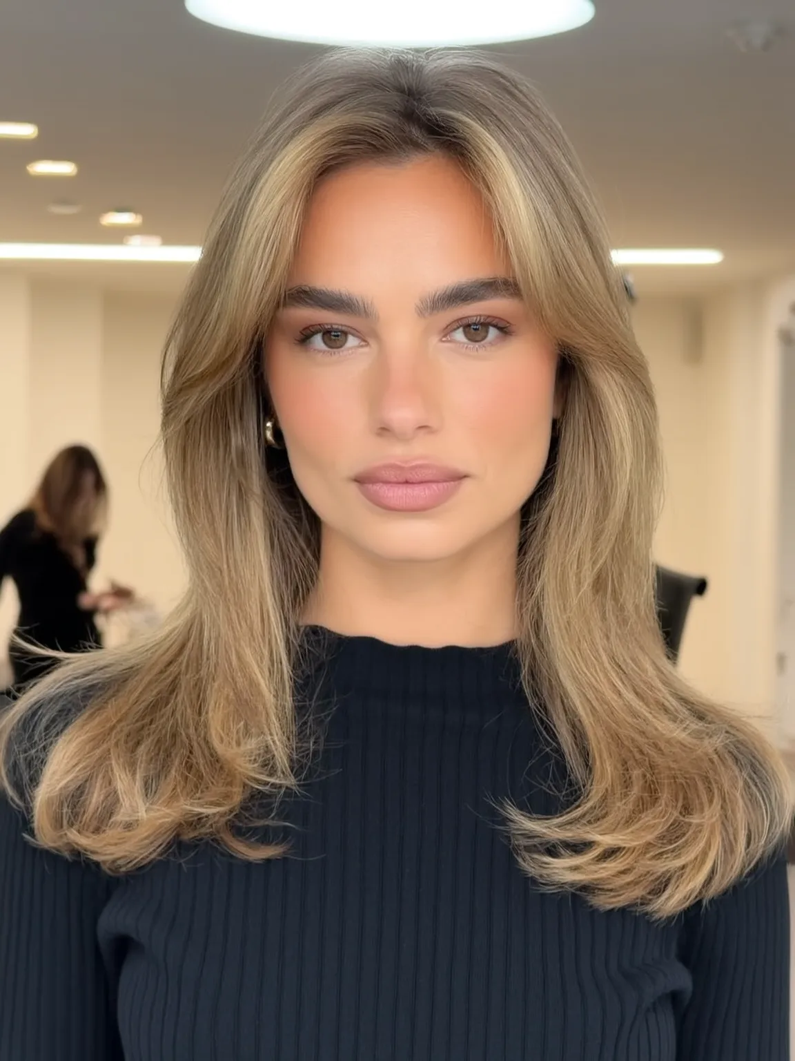 Sun-Kissed Warm Blonde Medium-Length Layers with Curtain Bangs